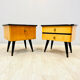 A pair of night cabinets