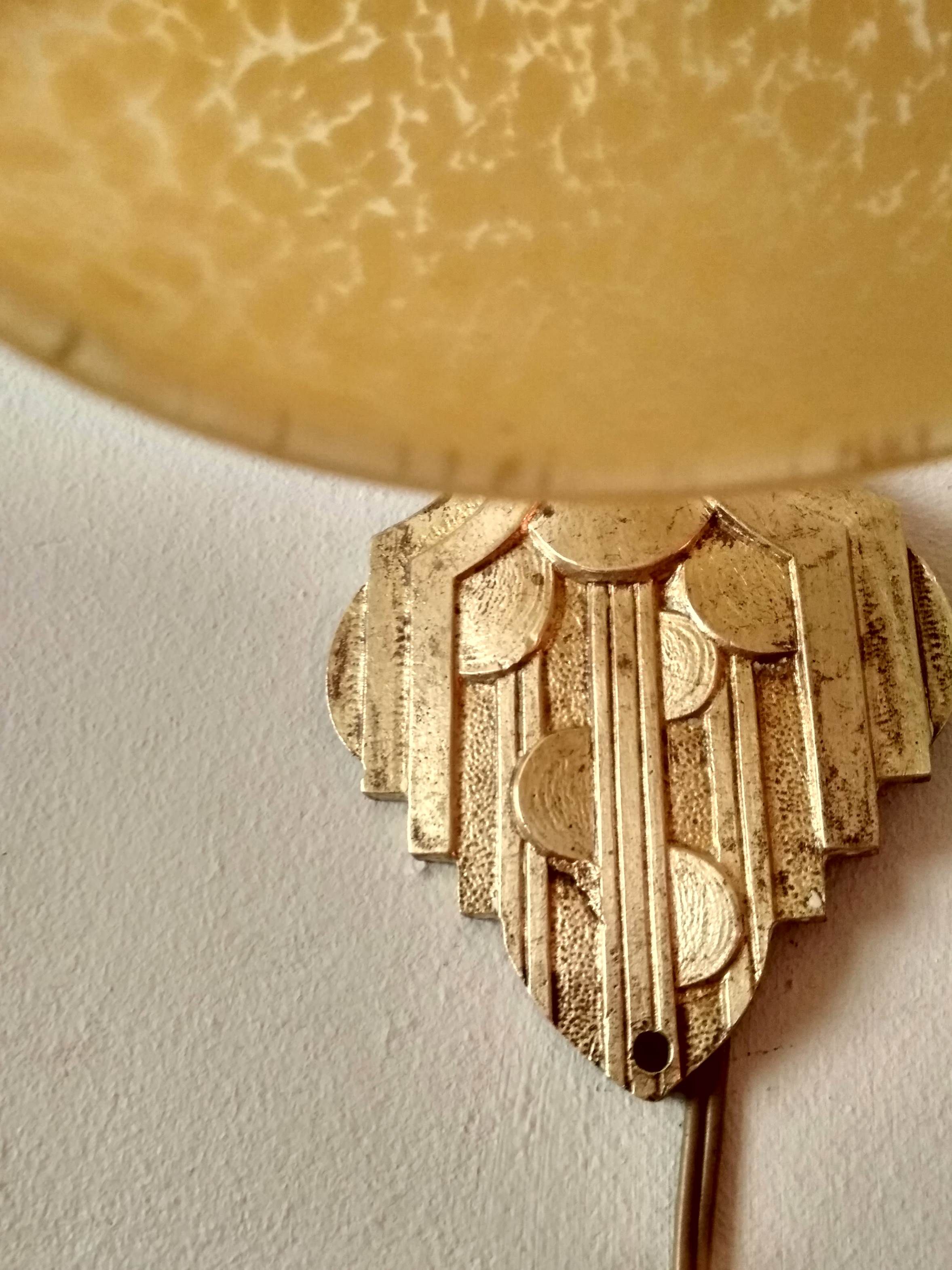 Art deco sconce, golden brass and yellow speckled Clichy glass globe