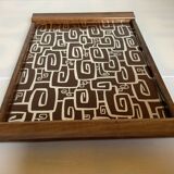 Old wooden tray with psychedelic art deco patterns