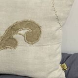 Cushion in vintage fabric with ornamentation