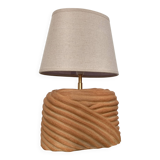 Oval table lamp in handcrafted ceramic with draped effect.