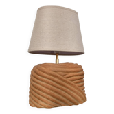 Oval table lamp in handcrafted ceramic with draped effect.
