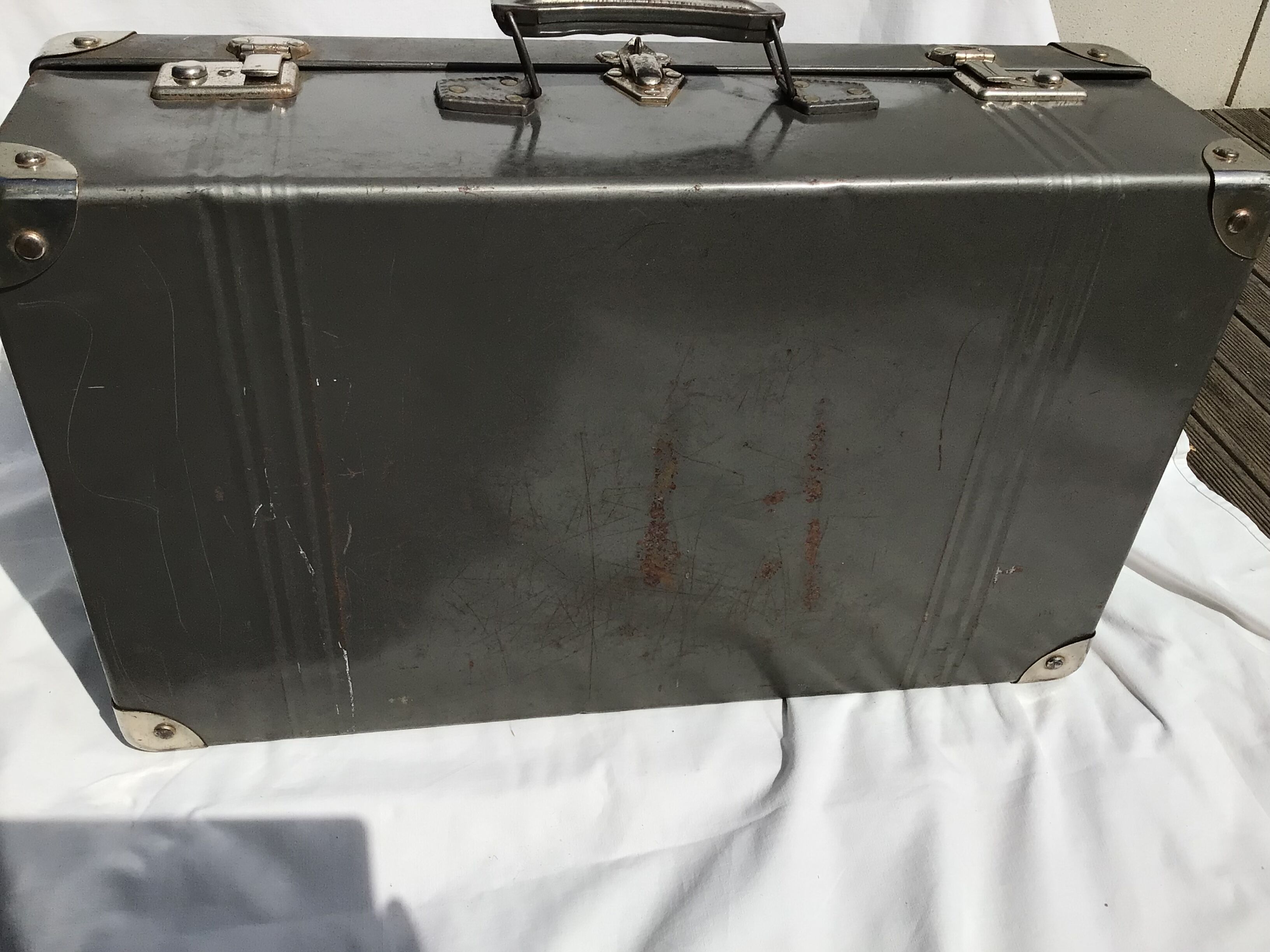 Vintage dark grey metal suitcase