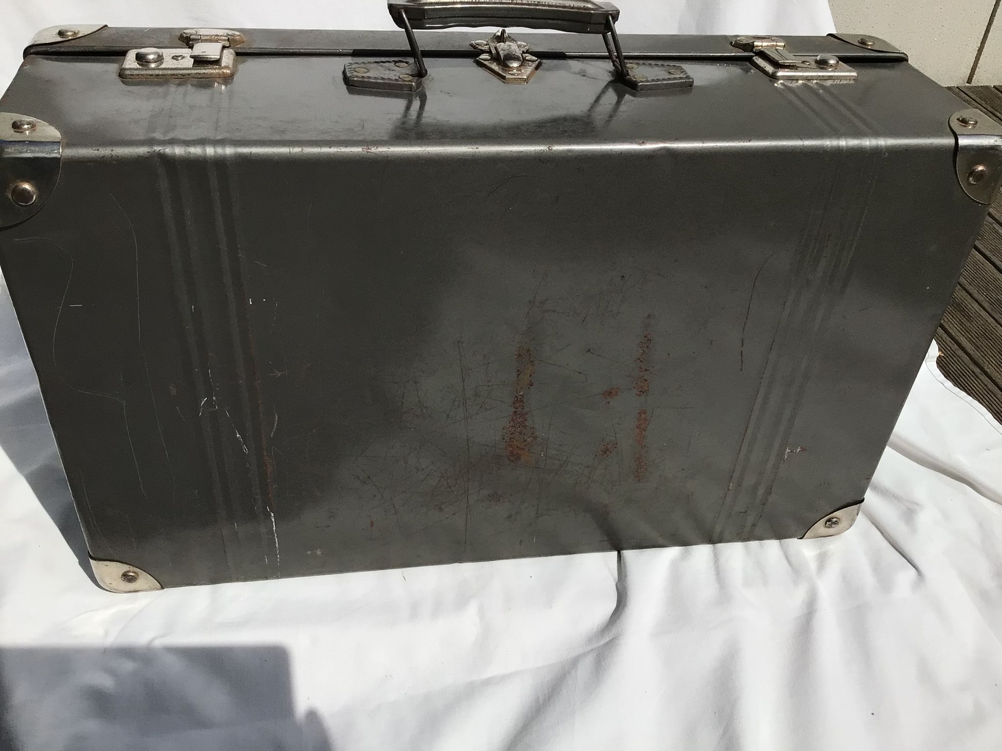 Vintage dark grey metal suitcase