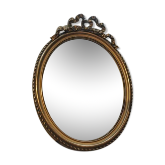 Louis XVI-style oval mirror in gilded stucco circa 1900