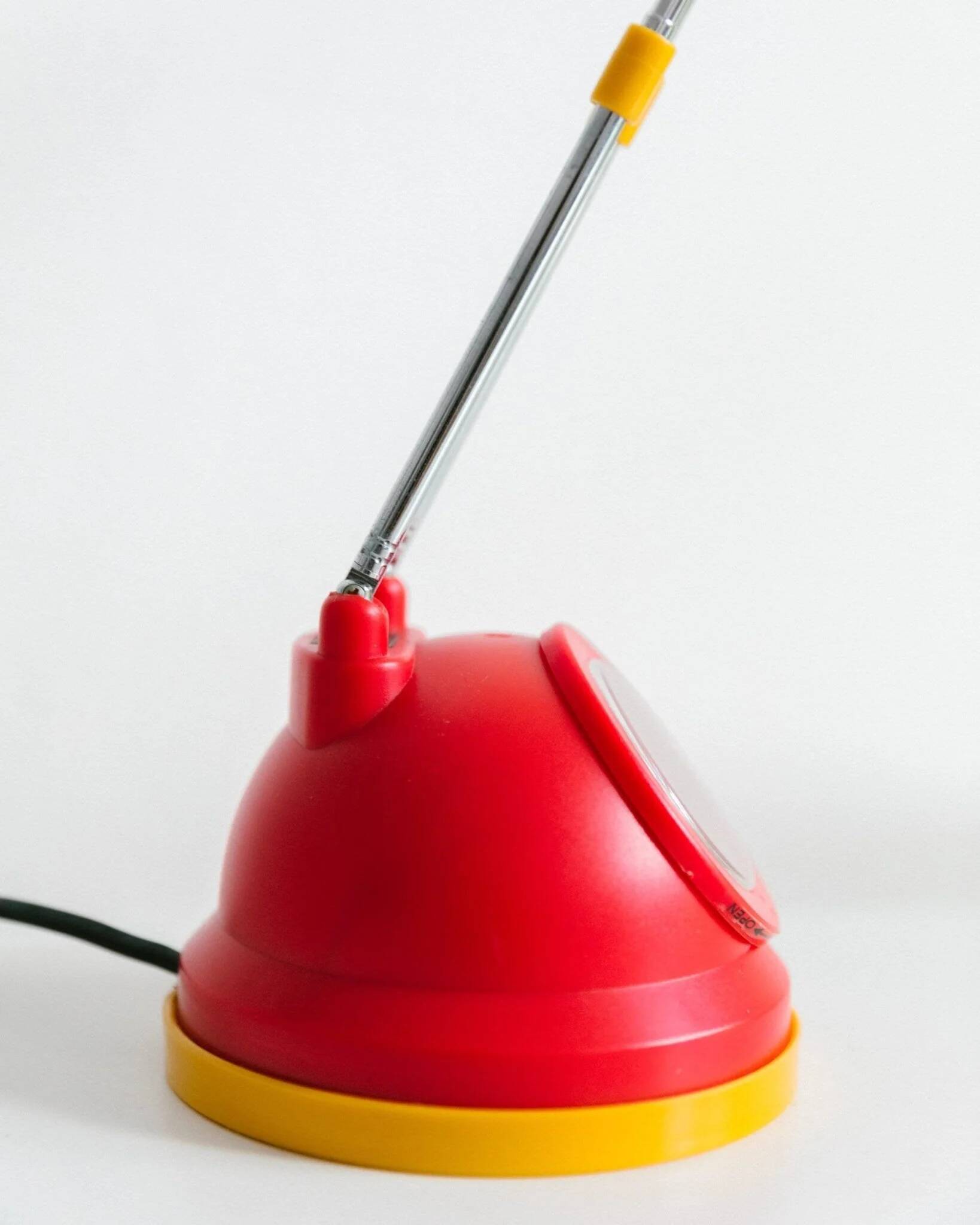 Blue-painted metal shade, chrome articulated arm desk lamp in Memphis-style 80s Pop Art with red base and yellow accents