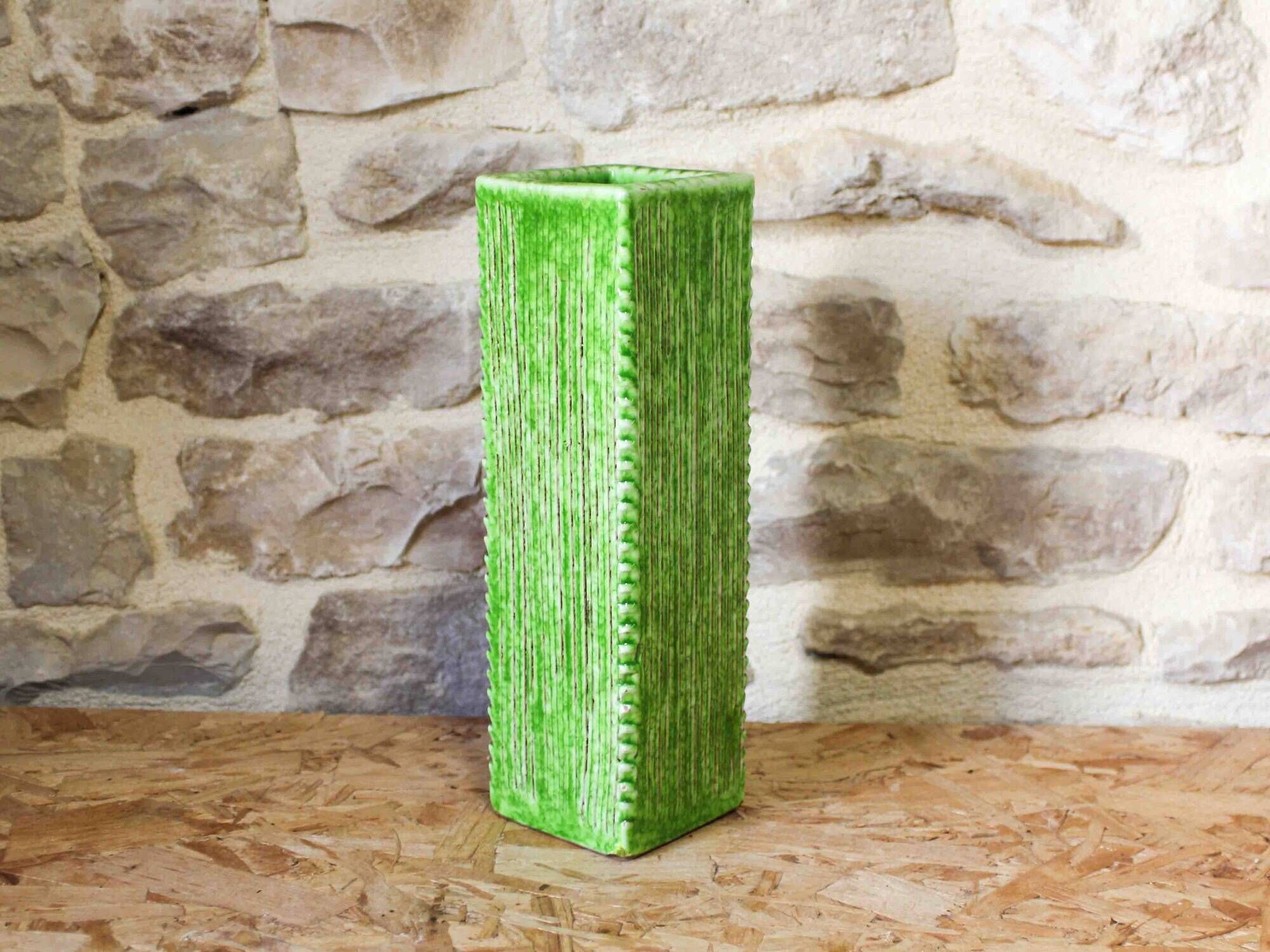 Incised ceramic vase with a square section