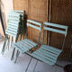 6 antique folding garden chairs made of painted wood and metal.