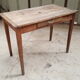 Old table feet spindles one drawer piling