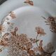 Antique iron earthenware plates accompanied by dishes
