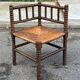Brutalist corner chair in turned wood with straw bobbins, 1960.