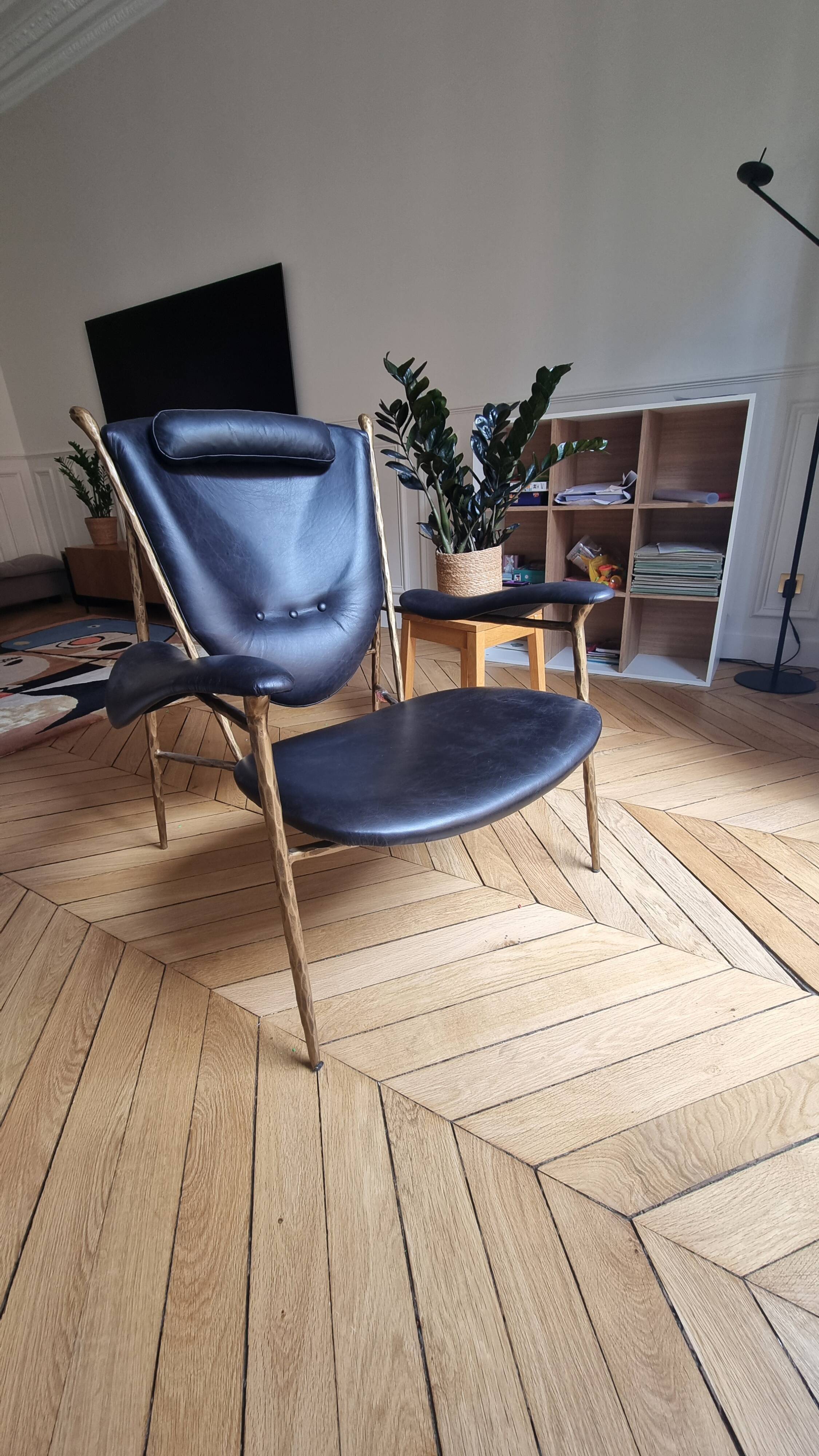 Black and golden bronze designer armchair