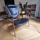 Black and golden bronze designer armchair