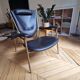 Fauteuil design noir et bronze doré
