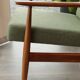 Vintage armchair in swamp green bouclé design by H. Lis.