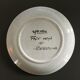 Signed floral decoration plate