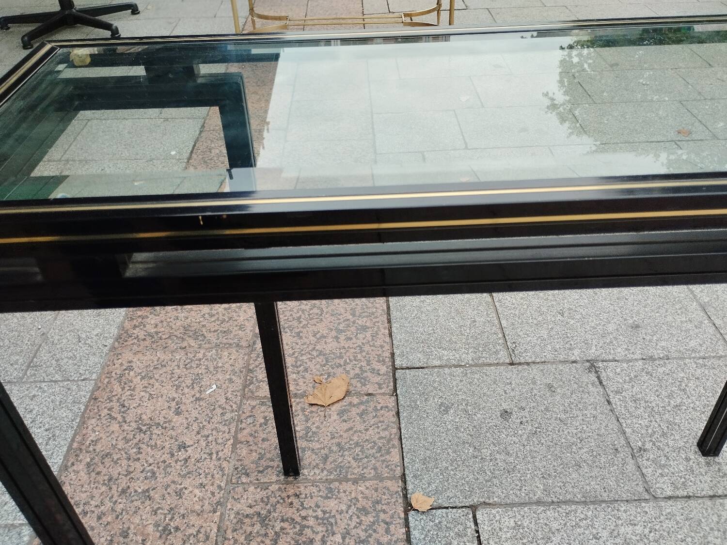 Old console with vintage glass top