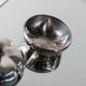 Ensemble vintage Christian Dior en argent massif : deux bols en métal avec couvercle et briquet intégré amovible, années 1970.