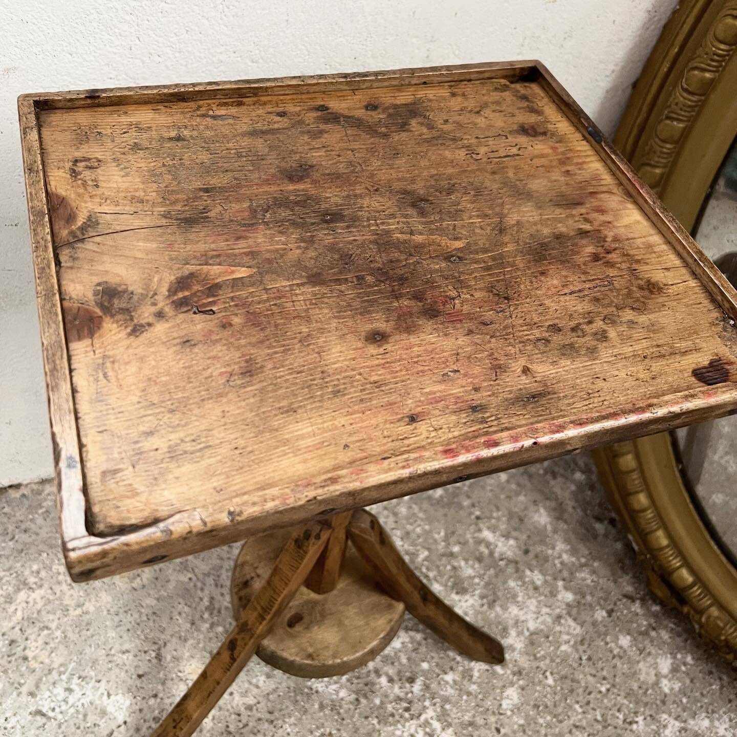 Old primitive wooden tripod pedestal table