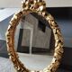 Hollywood Regency style oval Victorian mirror. In antique gold wood. 31 x 21cm