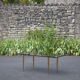 Smoked glass coffee table with adjustable brass legs, end of sofa, 70s table