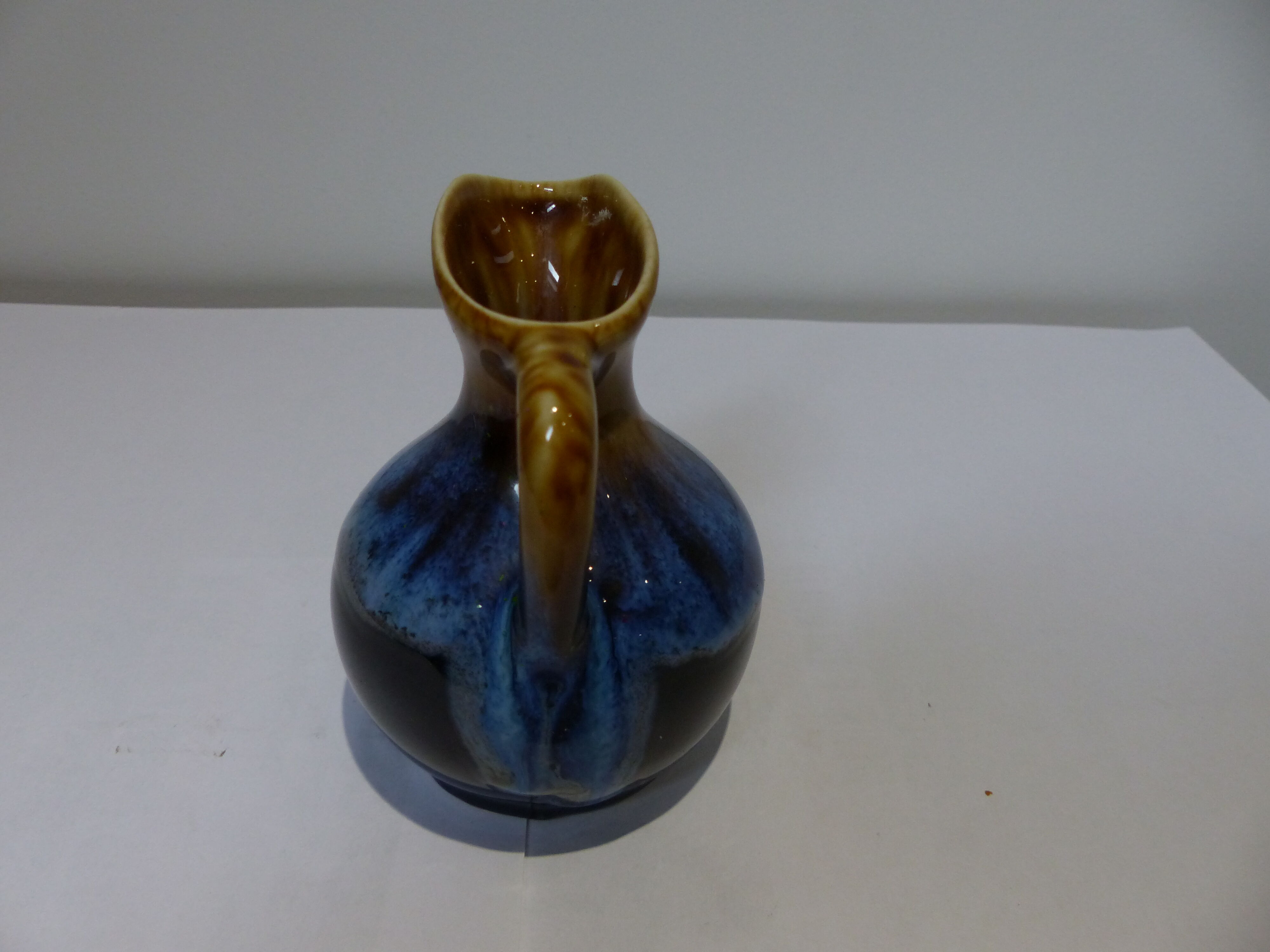 Small vintage ceramic pitcher Blue and brown black reflections