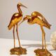 Couple of heron in vintage golden brass