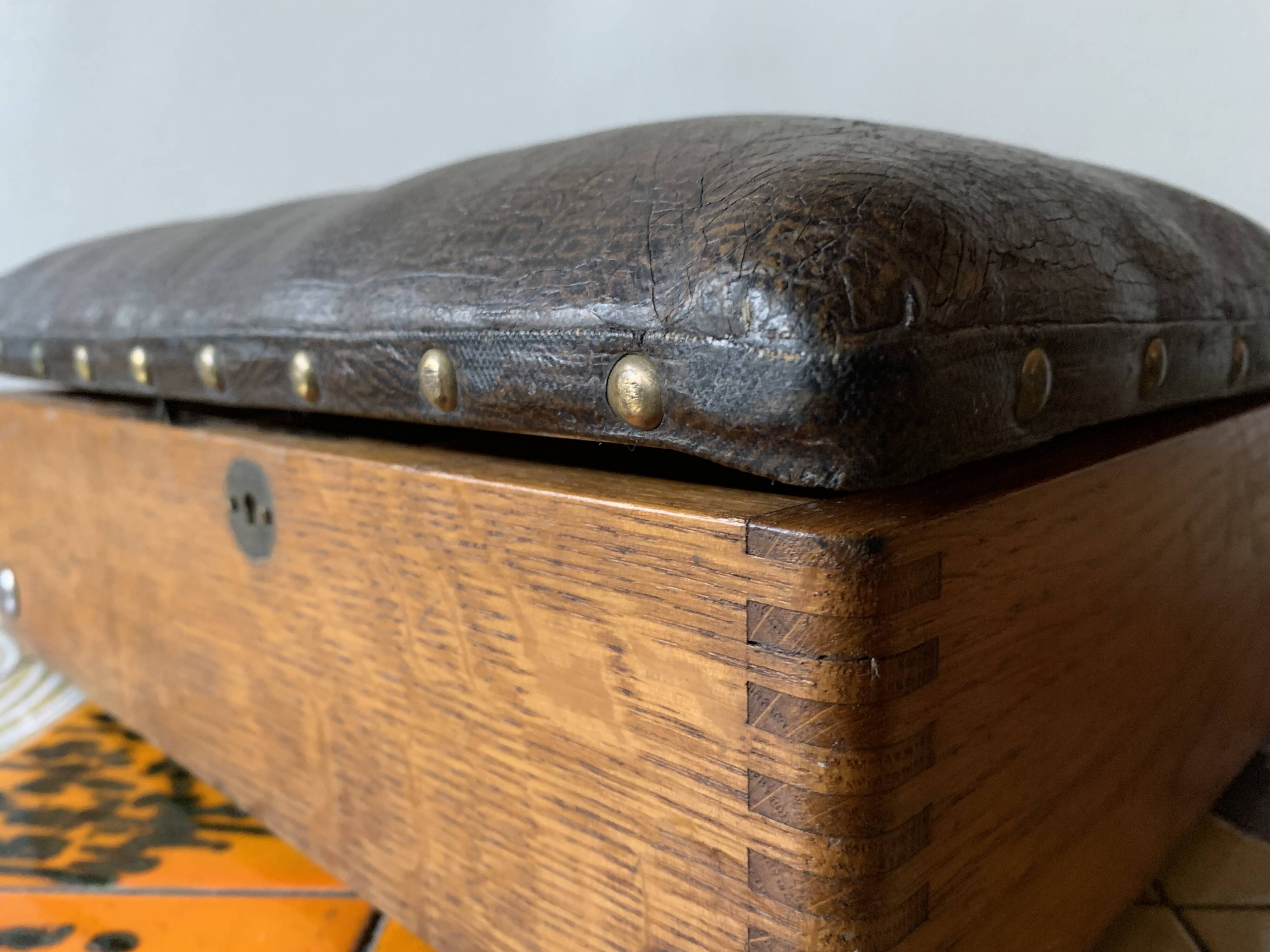 Old foldable fisherman's stool in wood and leather