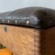 Old foldable fisherman's stool in wood and leather