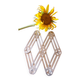 Vintage accordion folding metal trivet