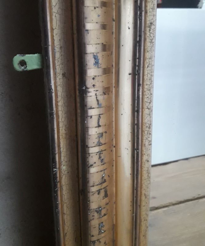 Golden Louis Philippe mirror H122xW84cm with gilded motifs.