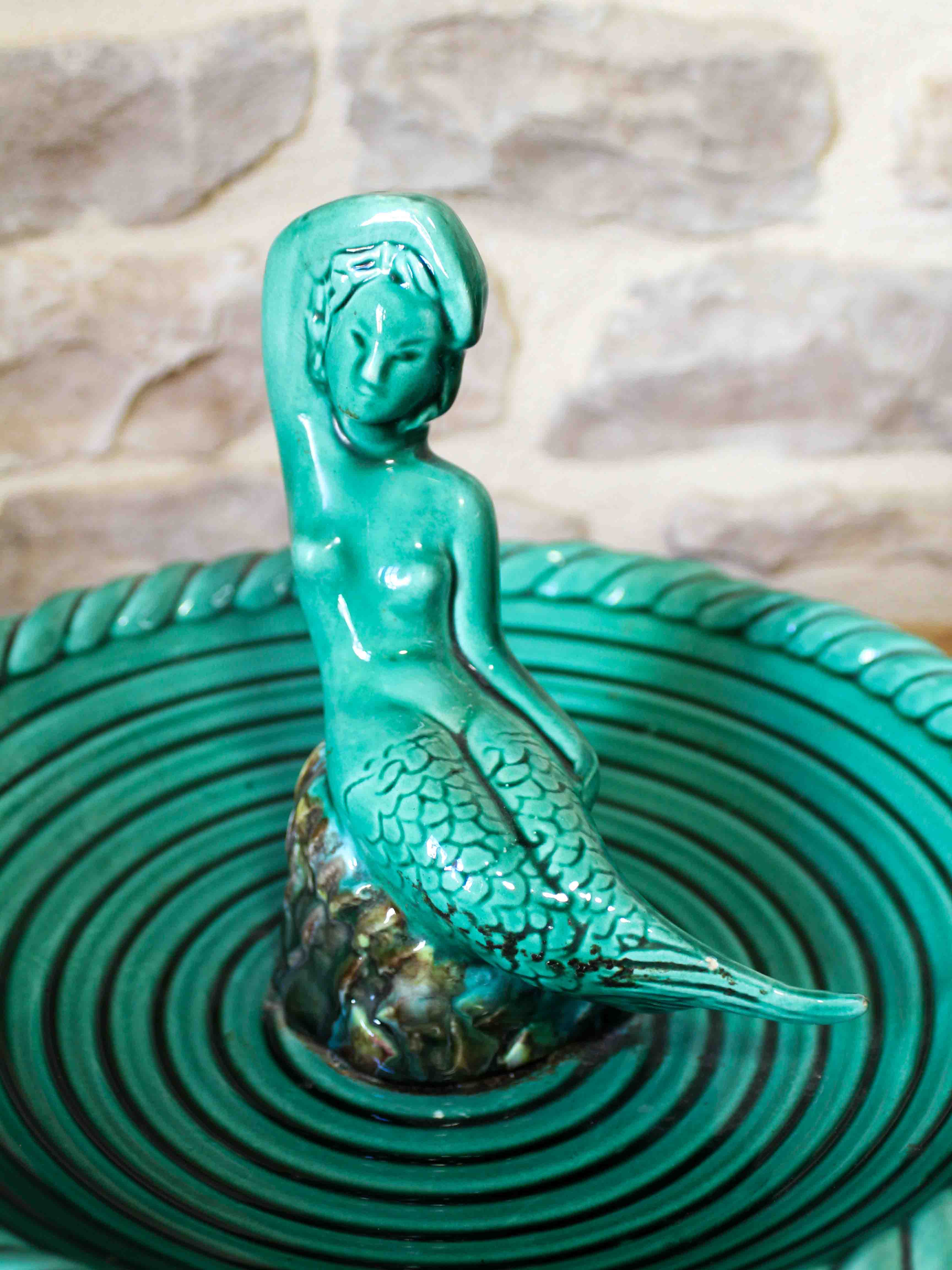Ceramic cup with mermaid decoration