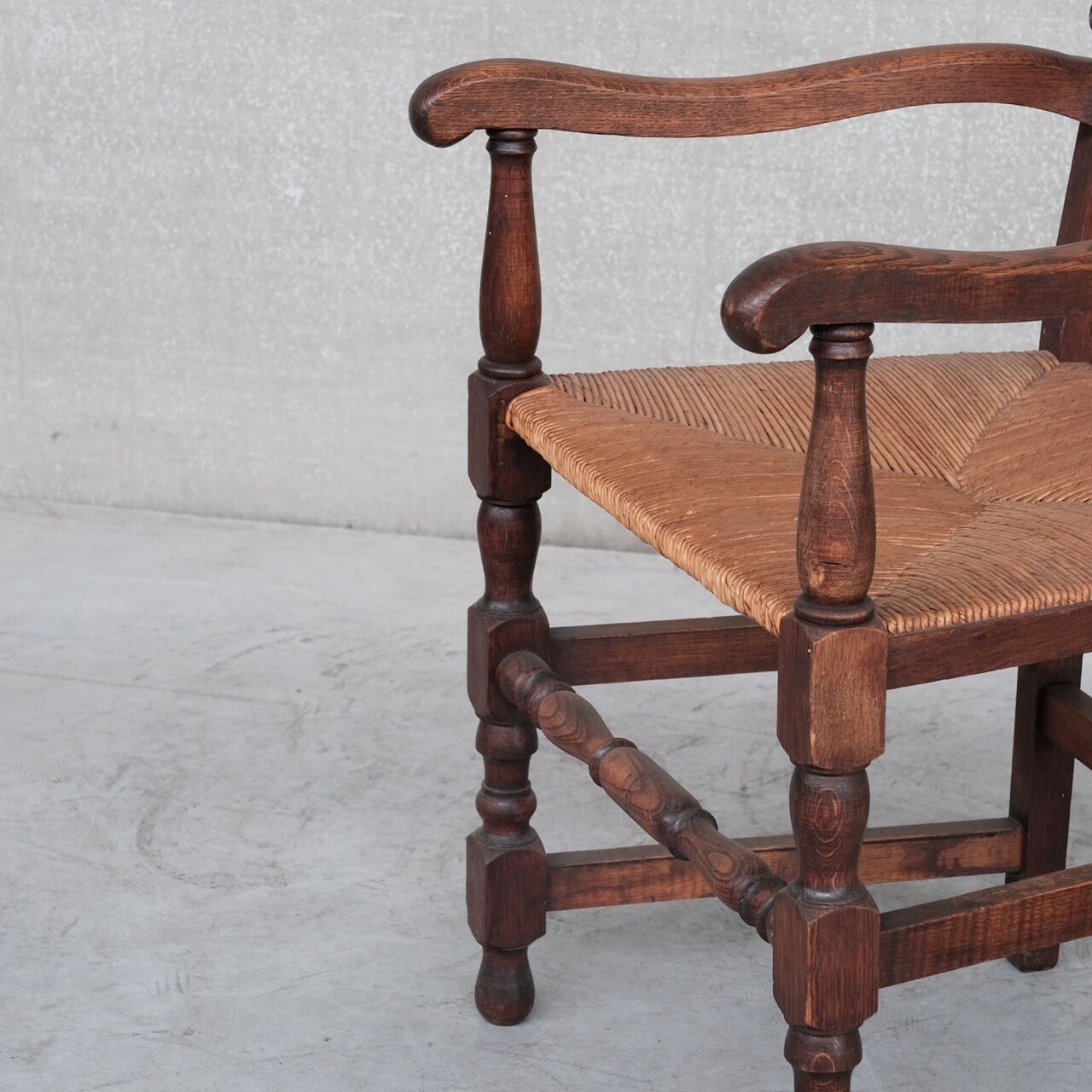 Pair of mid-century oak and rush french armchairs