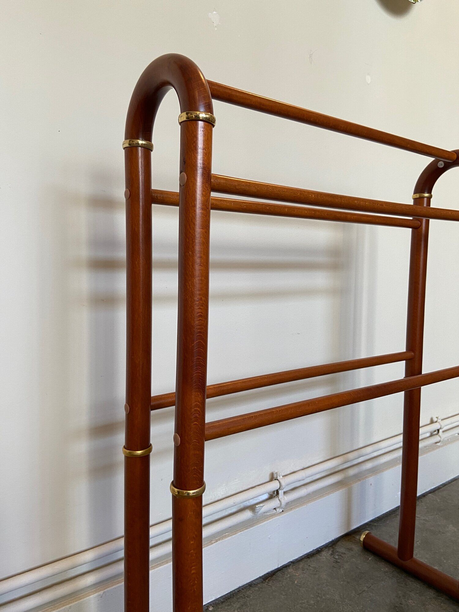 Dark wood towel rail