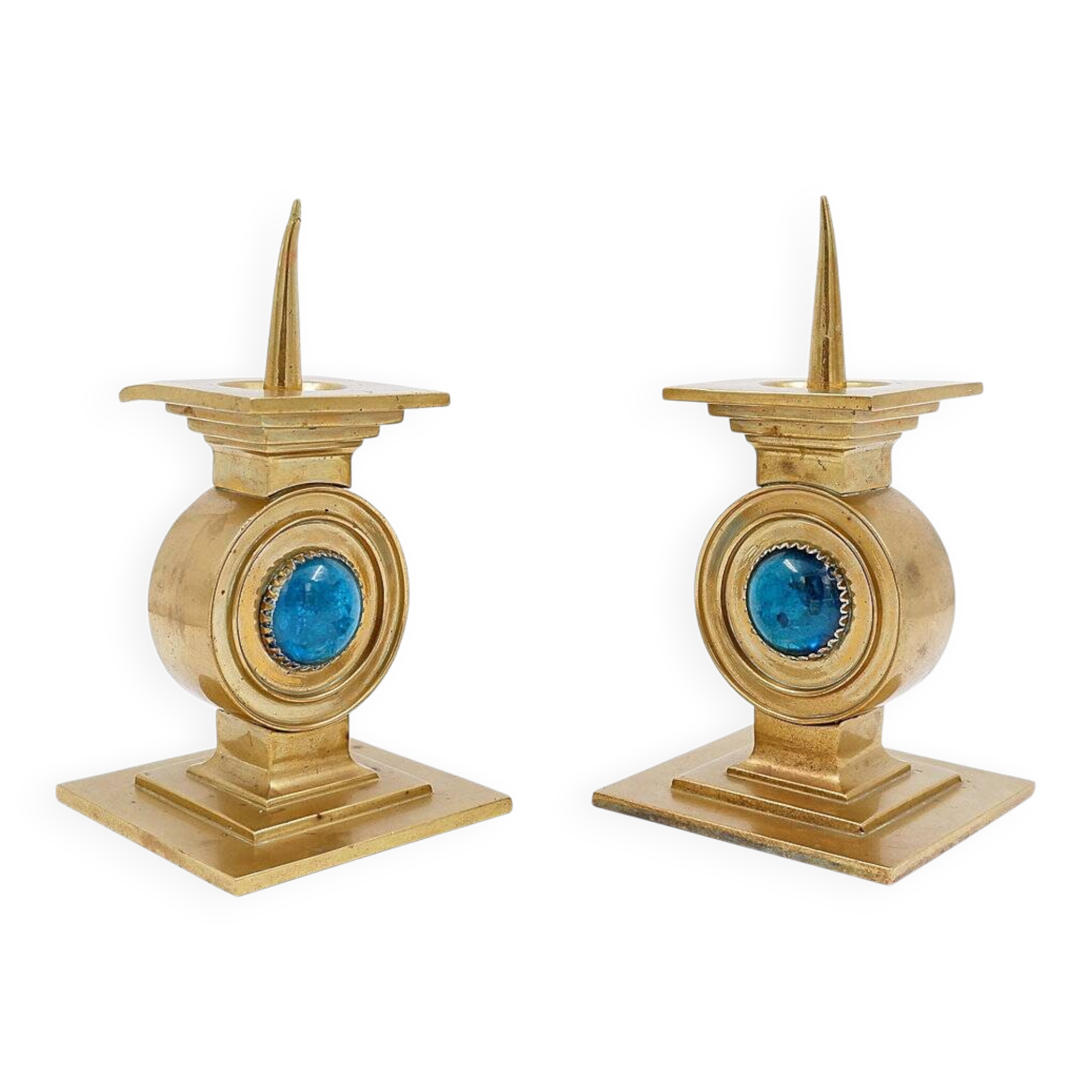 Pair of brass candlesticks decorated with a blue stone inlaid in the center