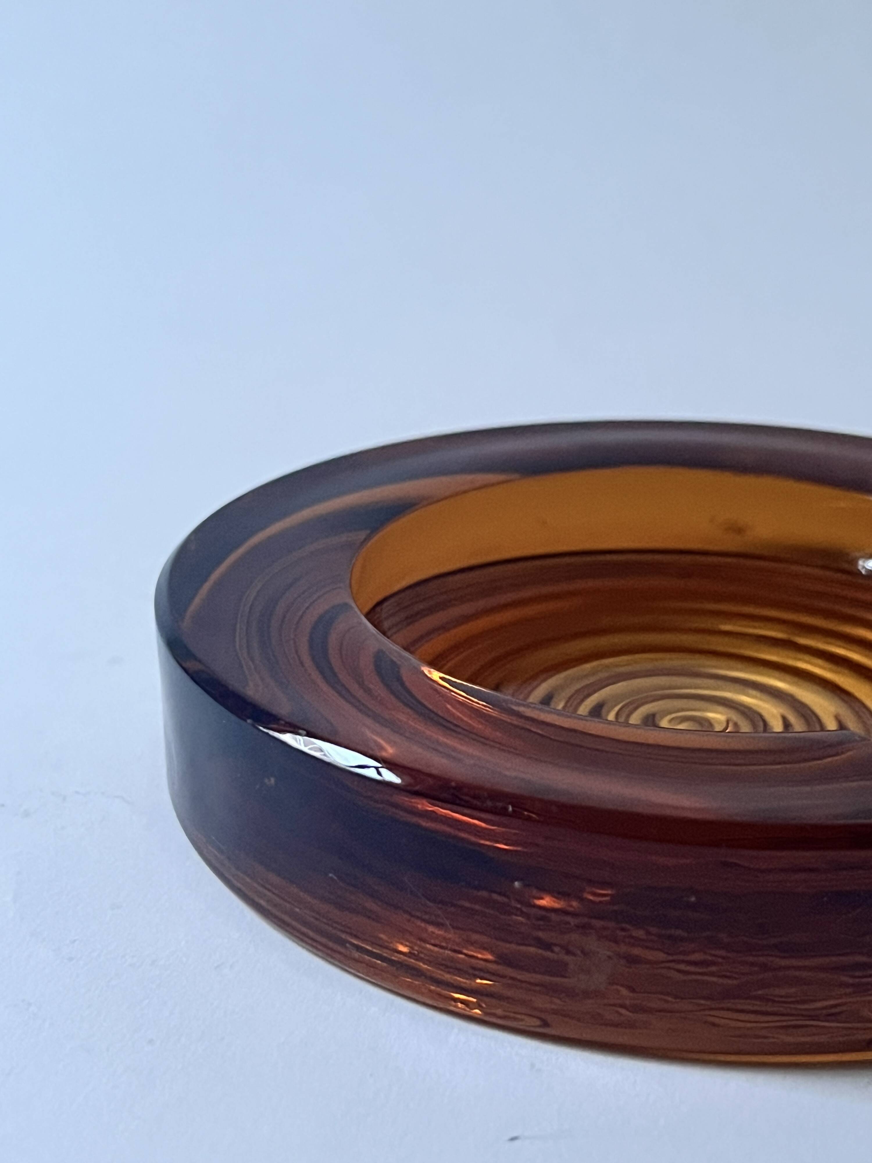Amber pressed glass ashtray, 1970s design.