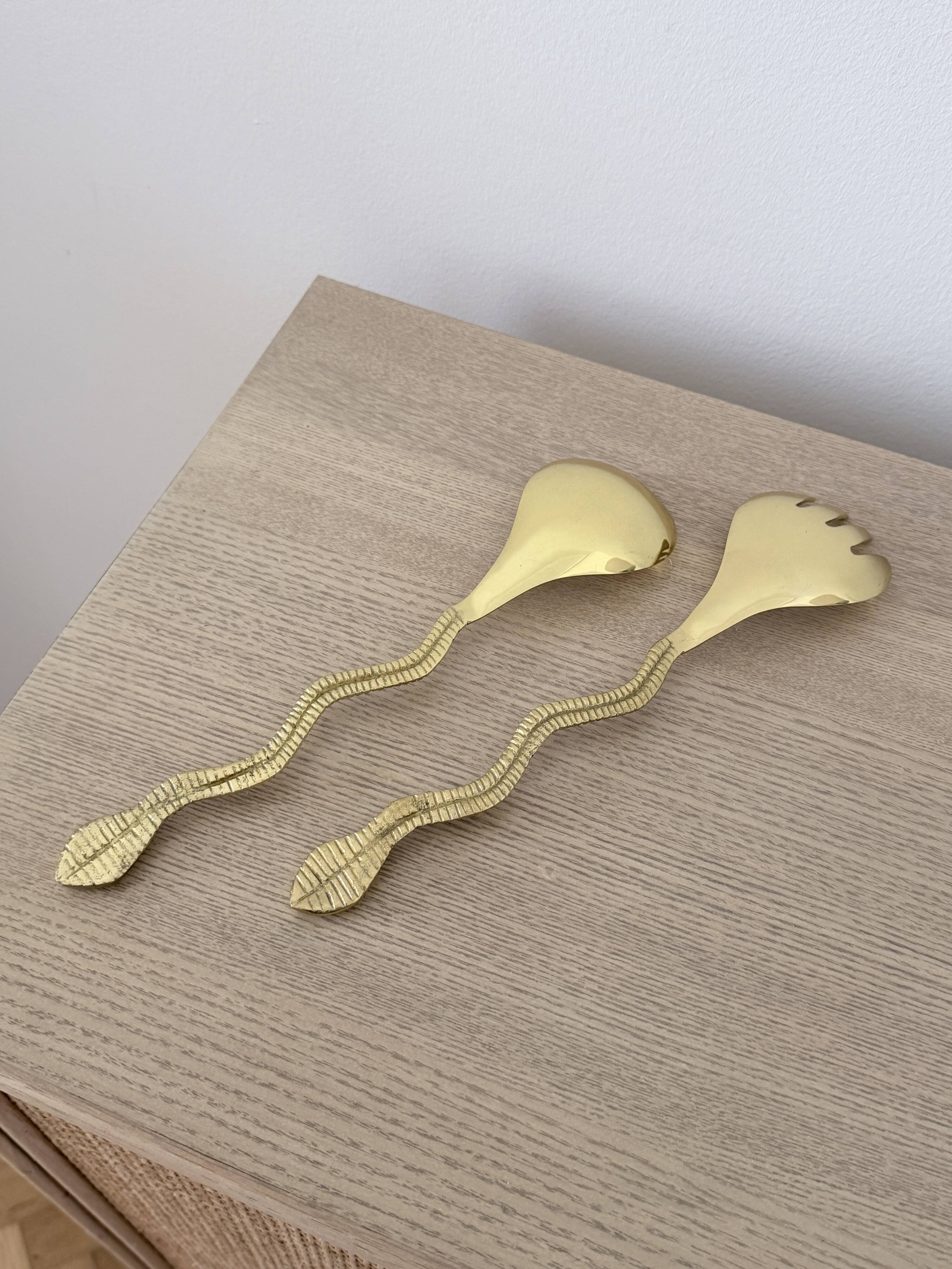 Gold metal snake salad serving set