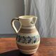 Beige carafe with stylized blue flower friezes