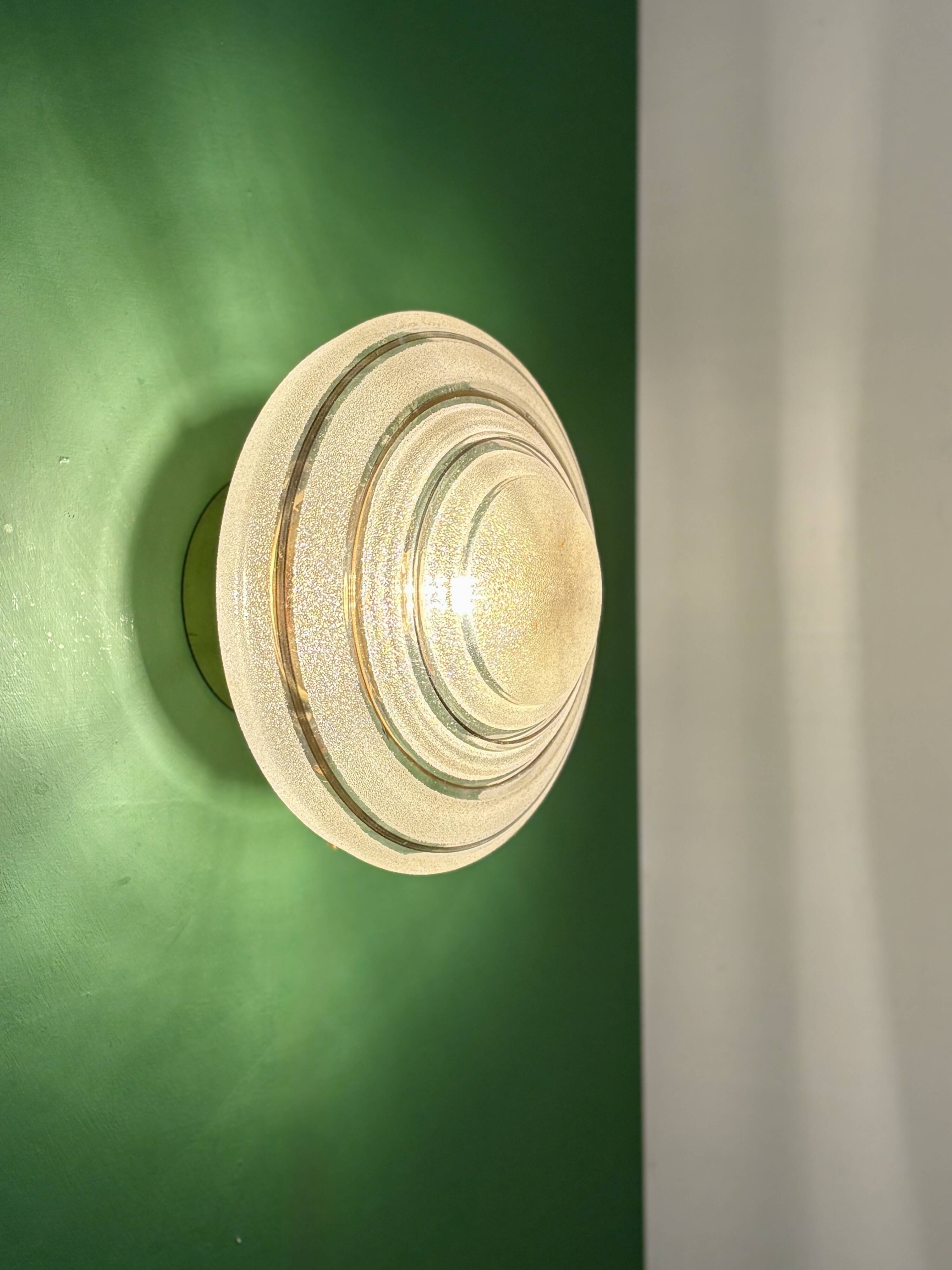 Old glass globe wall/ceiling light in frosted white and gold.