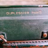 Green suitcase in vulcanized fibre
