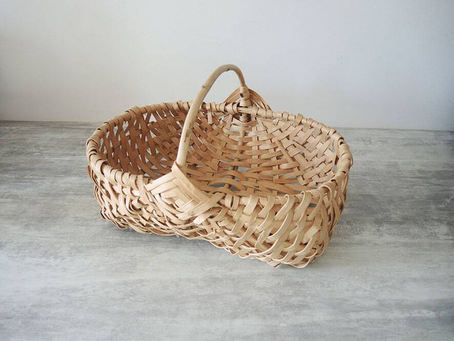 Old wicker basket / woven light leaves