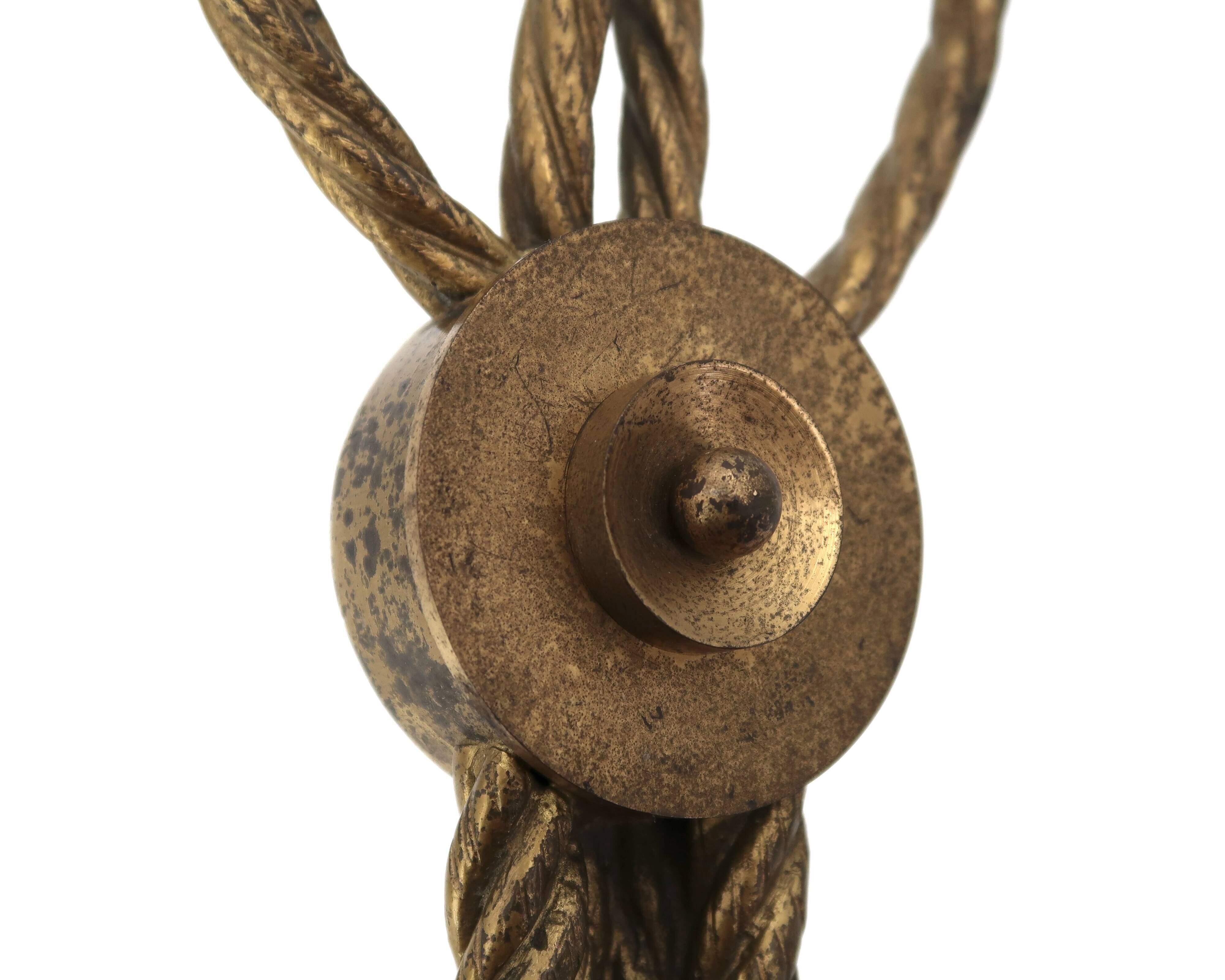 Golden wall lamp with two arms, decorated with a twisted rope bow, 1950s.