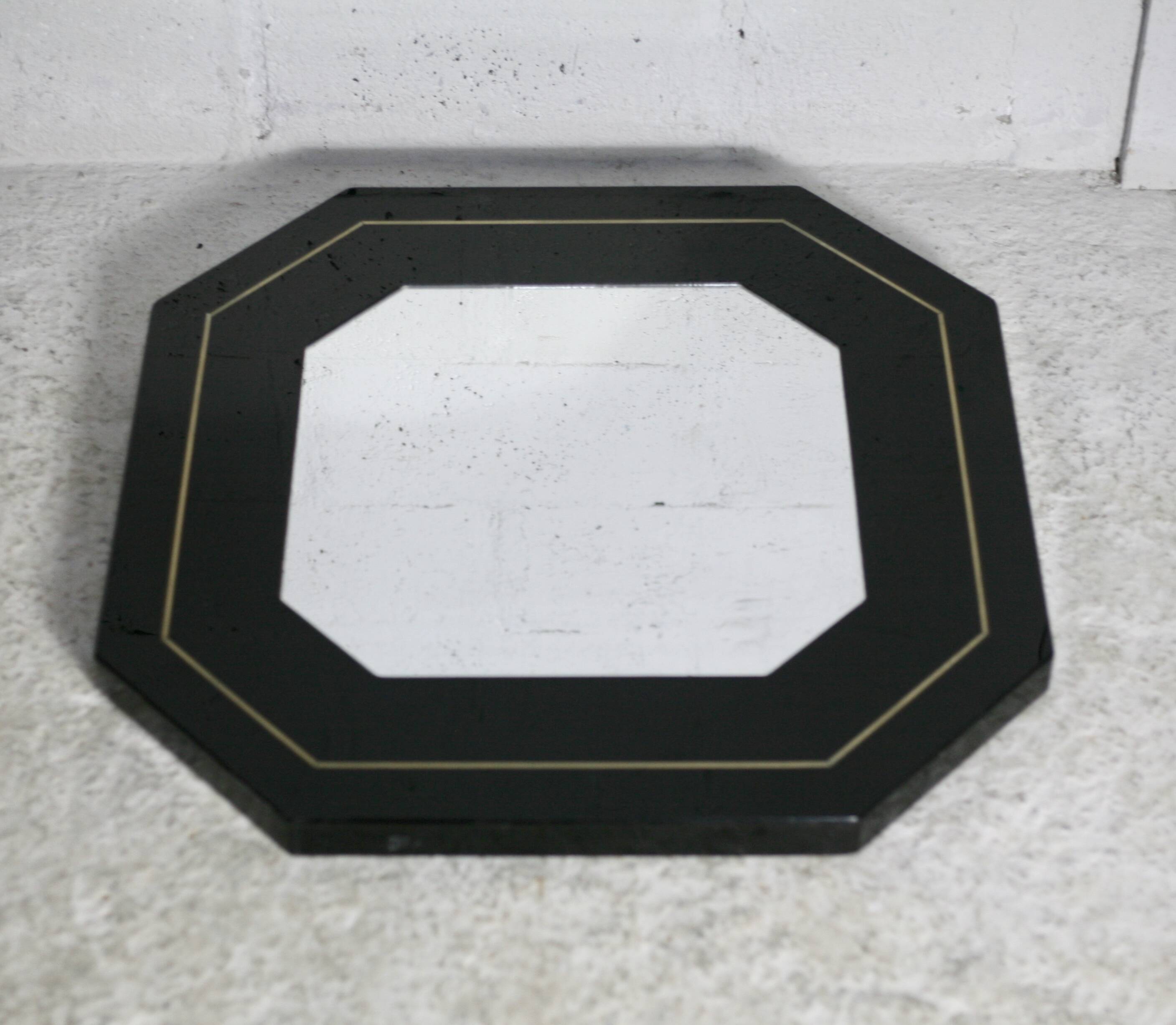 70s mirror, black lacquered wood, brass edging. Octagonal