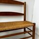 Old wooden and straw bench