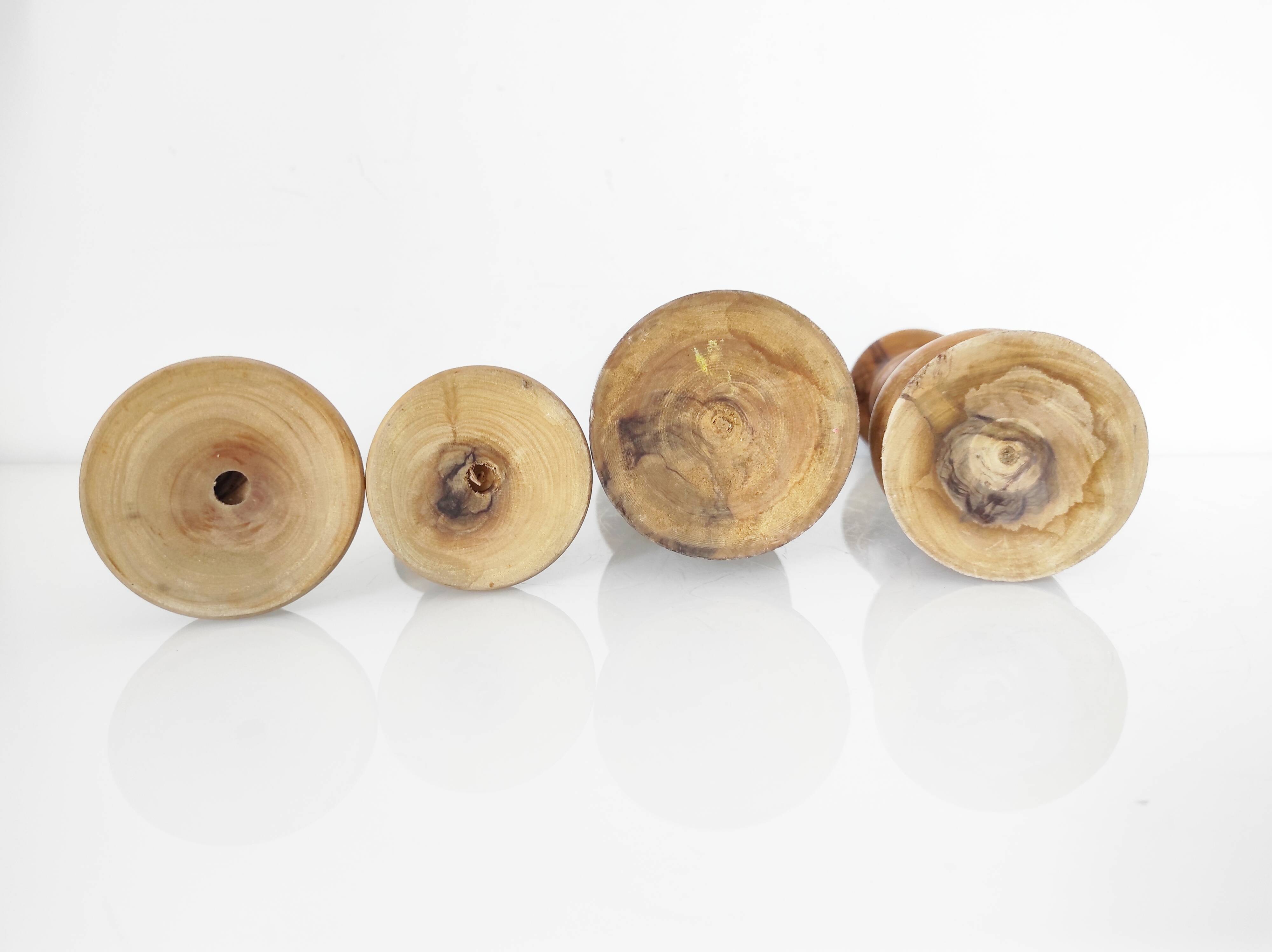 Set of 4 turned wooden candle holders