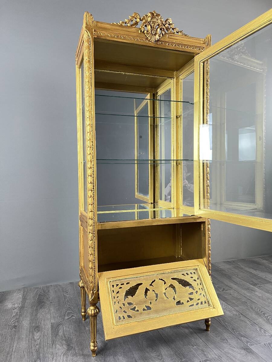 Carved and gilded wooden display cabinet, Louis XVI style, 20th century.