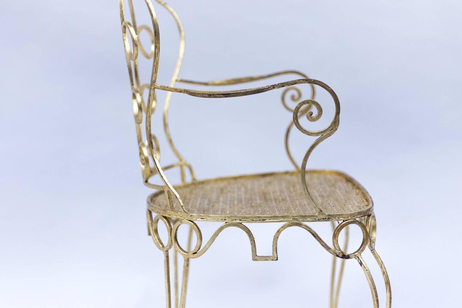 Pair of wrought iron and gilded armchairs, circa 1990