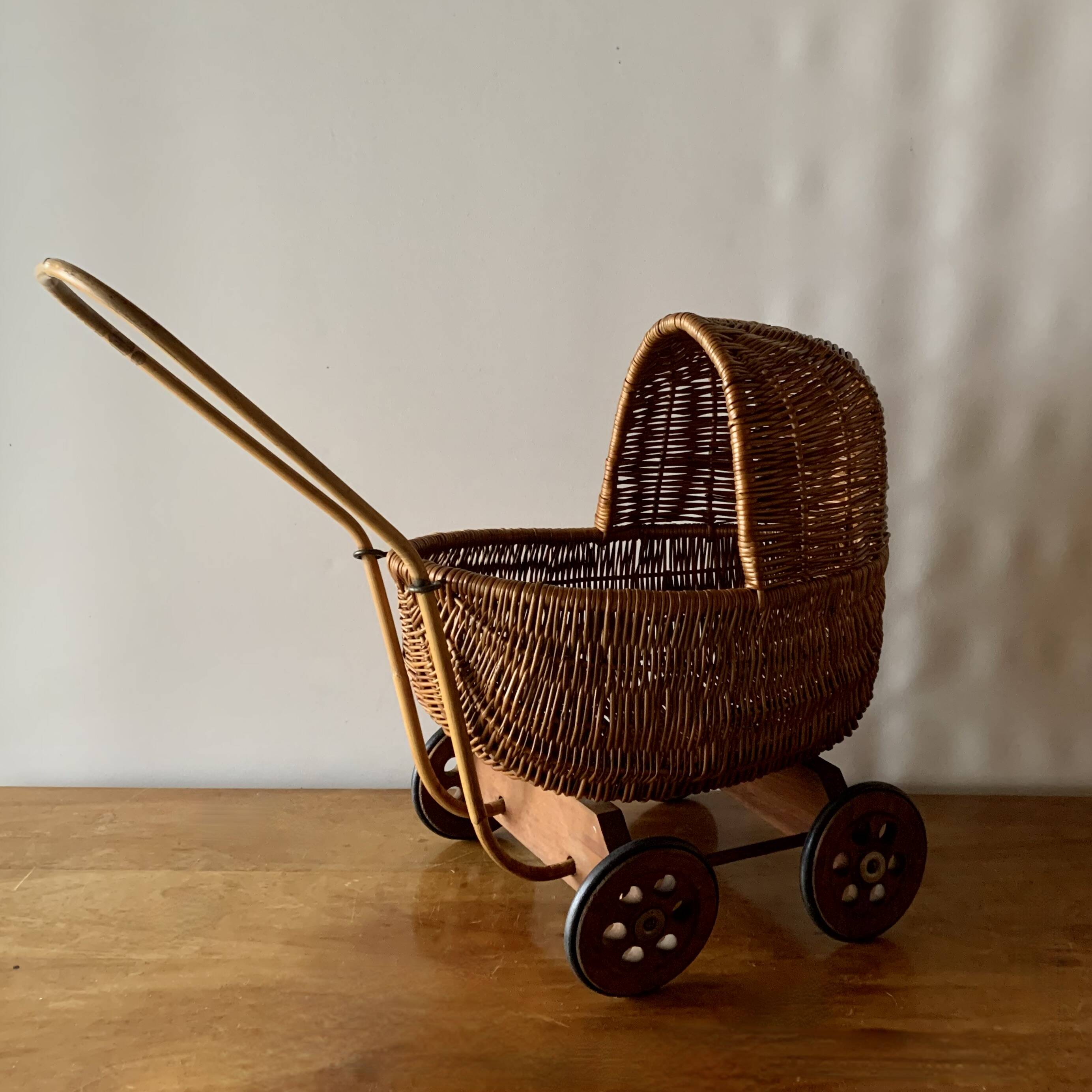 Old wicker dolls' pram - wooden wheels