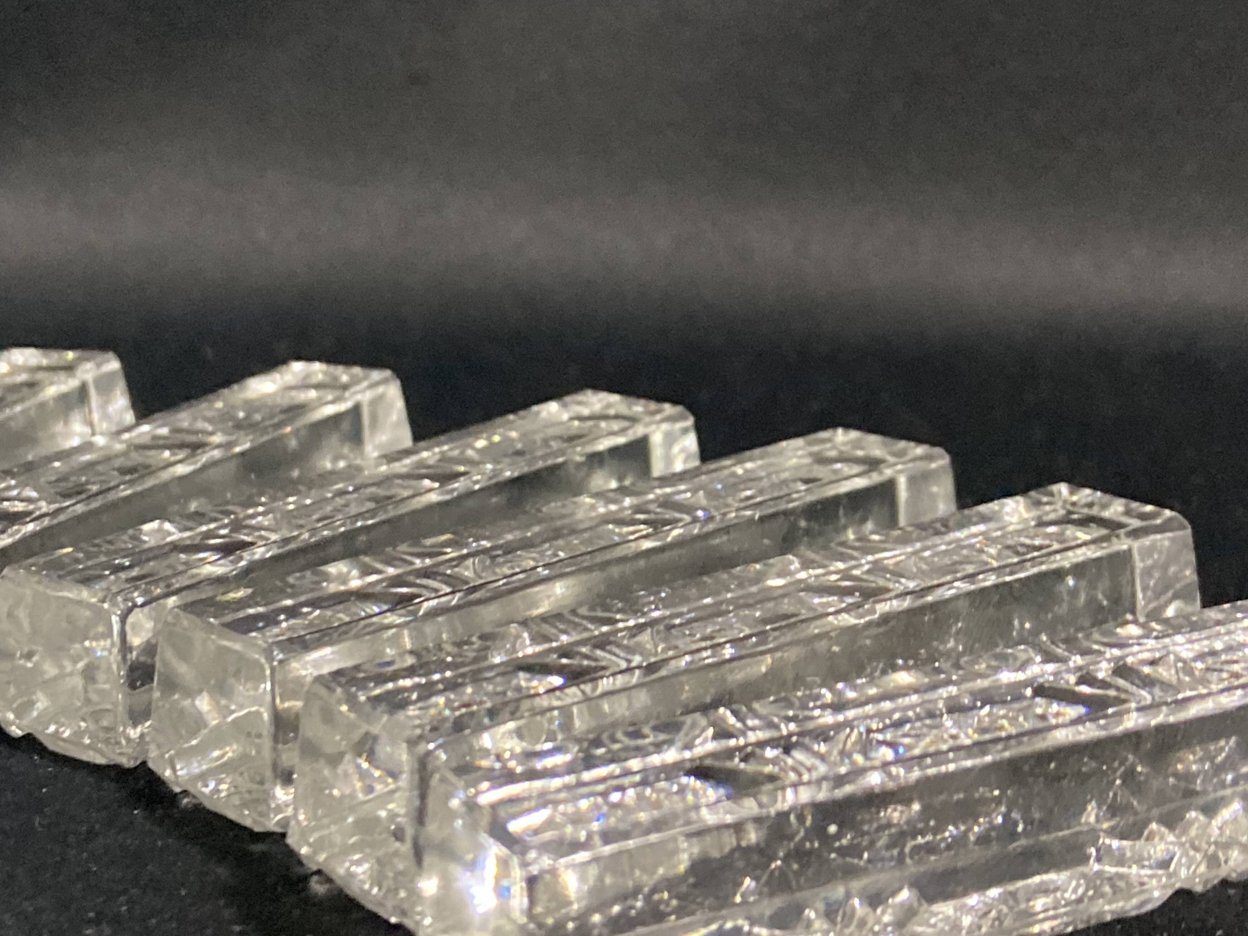 Set of 12 molded glass or crystal knife rests with diamond point decor