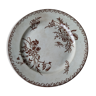 Old round dish with flowers